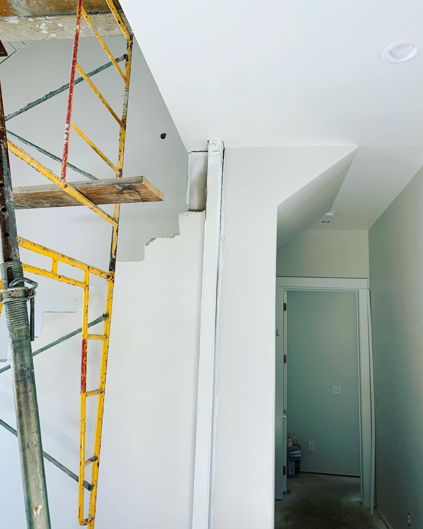 Entry way before wood beam accents