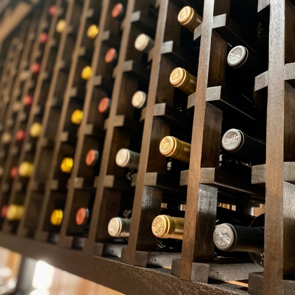 Close up of wine bottle in wine cellar.