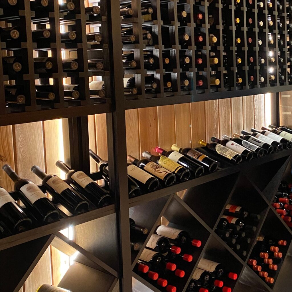 Close up of wine bottles in wine cellar.