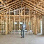 Greg Byrus measuring layout in new build