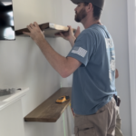Greg Byrus installing shelves