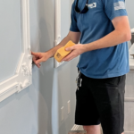 Greg Byrus installing custom wall trim