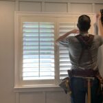 Greg Byrus installing board and baton trim